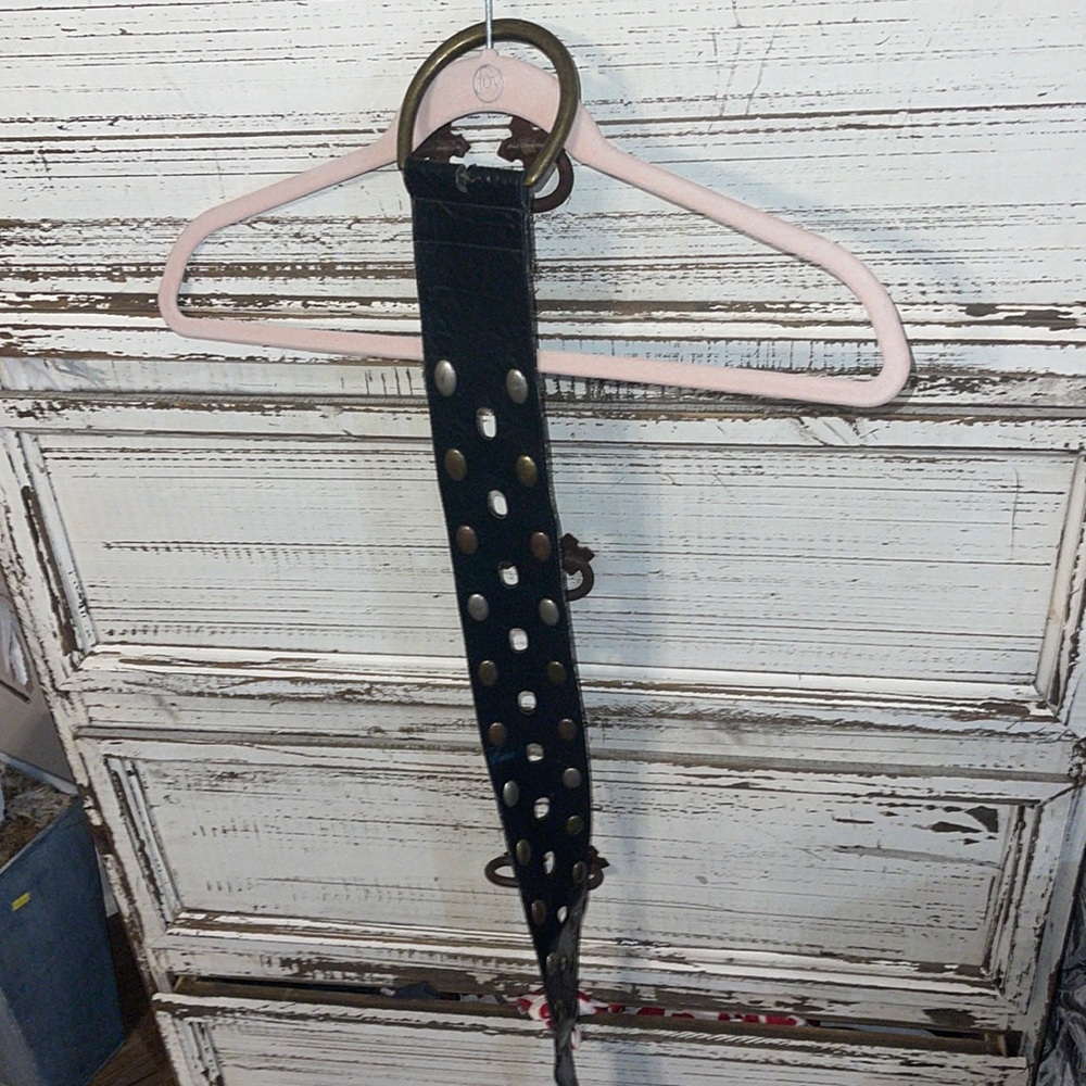 Black leather belt with silver and gold stones size 1x it’s missing part